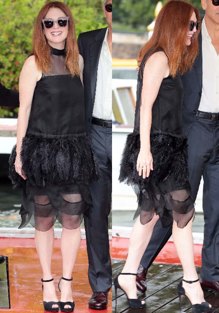 Julianne is all-smiles as she arrives in a Prada dress