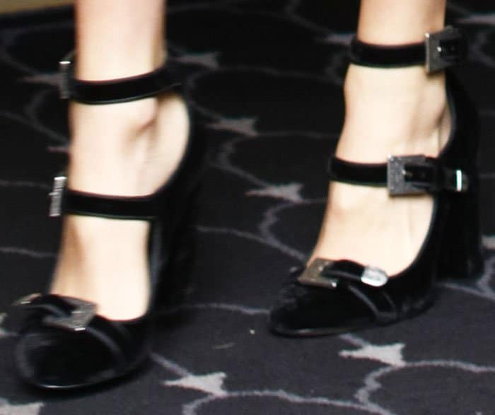 Kaia Gerber’s black velvet pumps featured triple ankle straps and crystal-trimmed buckles that added a refined retro finish to the look