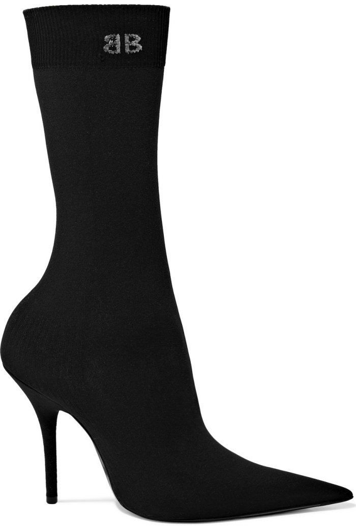 Balenciaga’s black stretch-jersey sock boots feature the brand’s signature knife-sharp pointed toe, a slim stiletto heel, and a ribbed cuff embroidered with the BB logo