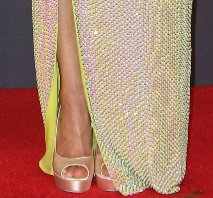 Gugu Mbatha-Raw showing off her pedicured toes in Jimmy Choo's "Vibe" platform pumps