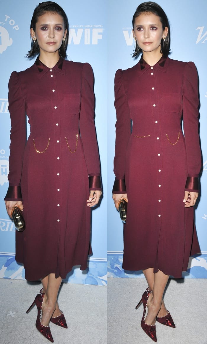 Nina Dobrev in a burgundy button front dress at Variety and Women in Film’s 69th Pre-Emmy Awards party
