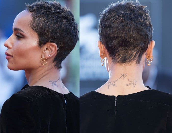 Her cropped pixie cut and delicate neck tattoos added edge to the refined red-carpet look, complemented by small gold hoop earrings