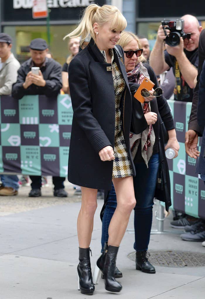 Anna Faris leaving AOL Build in New York wearing a yellow-brown check pattern dress on October 23, 2017