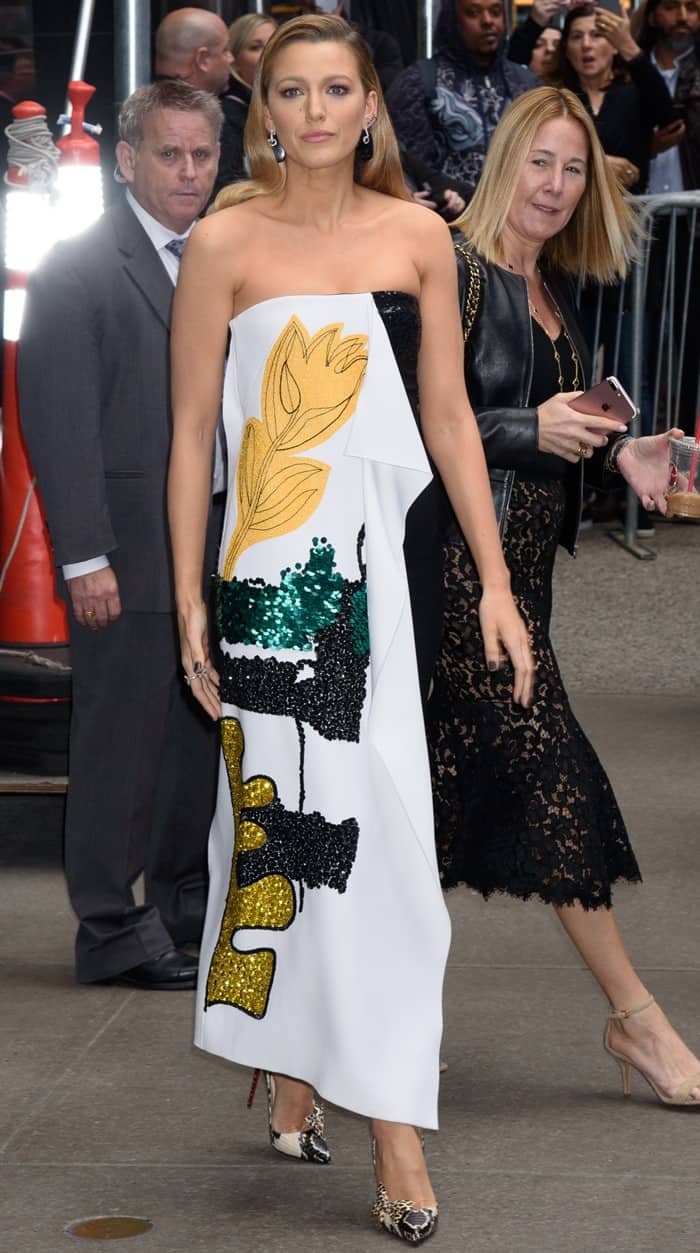 Blake Lively pauses outside Good Morning America, highlighting the sculptural bodice and sequined detailing of her strapless ensemble