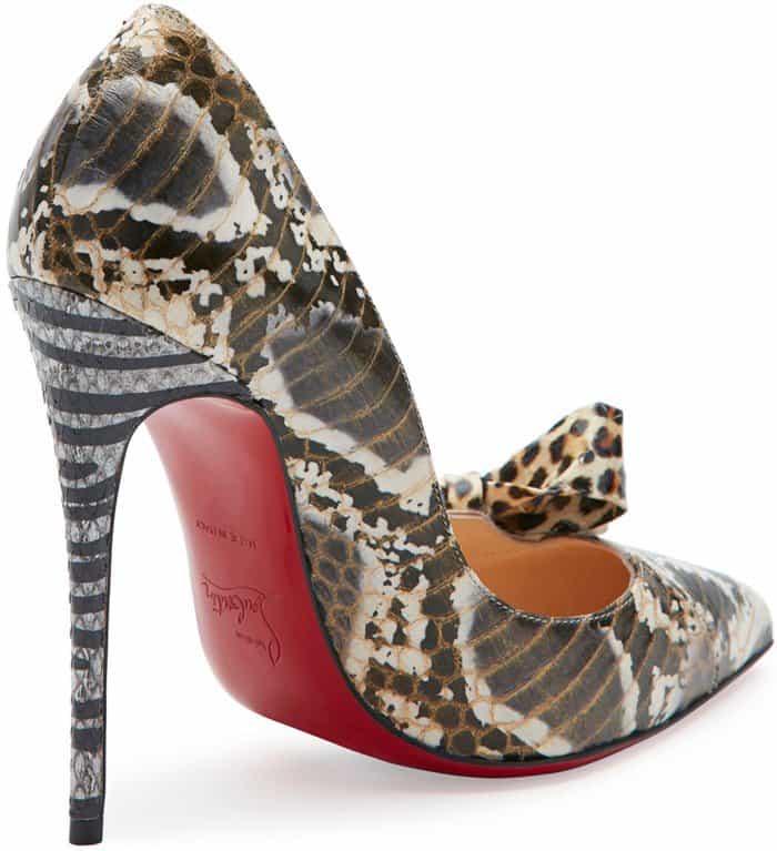 Christian Louboutin’s ‘Madame Menodo’ pumps feature a pointed-toe silhouette in mixed watersnake leather, finished with a leopard-print bow, striped stiletto heel, and signature red sole