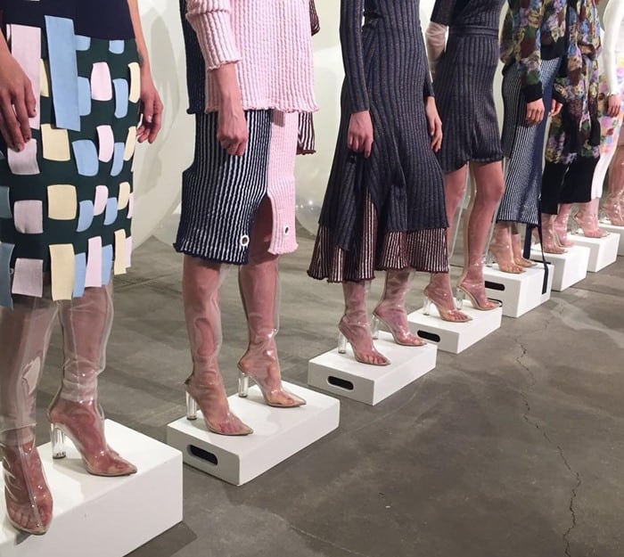 Models line up in clear, foggy thigh-high boots at the PH5 Fall 2017 show, showcasing the impractical side of transparent footwear trends