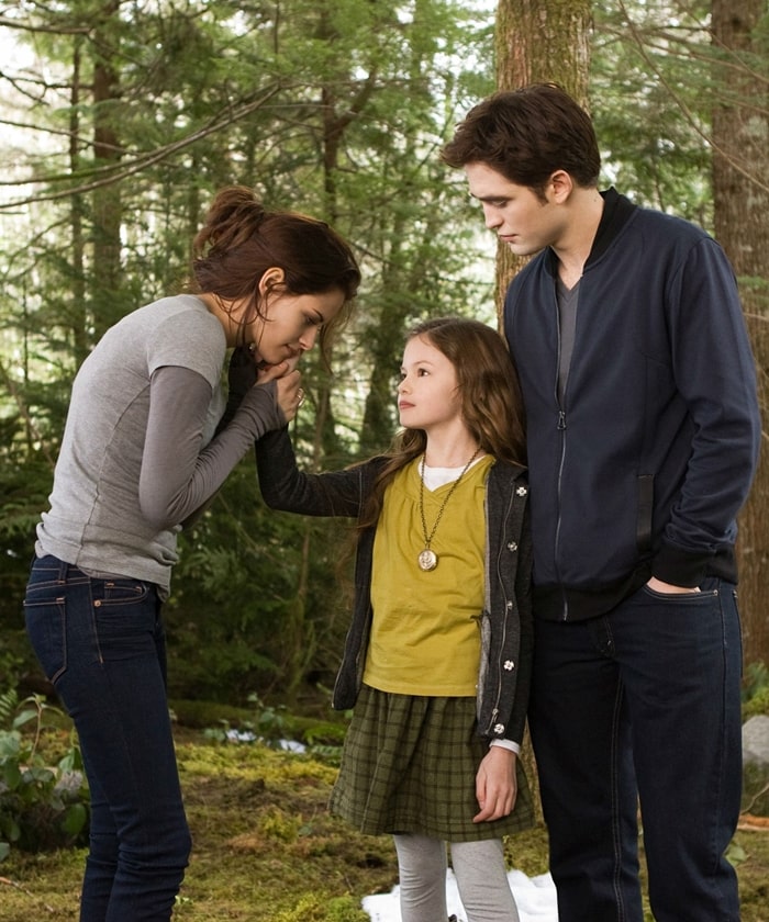 Mackenzie Foy as Renesmee Cullen with her on-screen parents Kristen Stewart and Robert Pattinson in The Twilight Saga: Breaking Dawn – Part 2