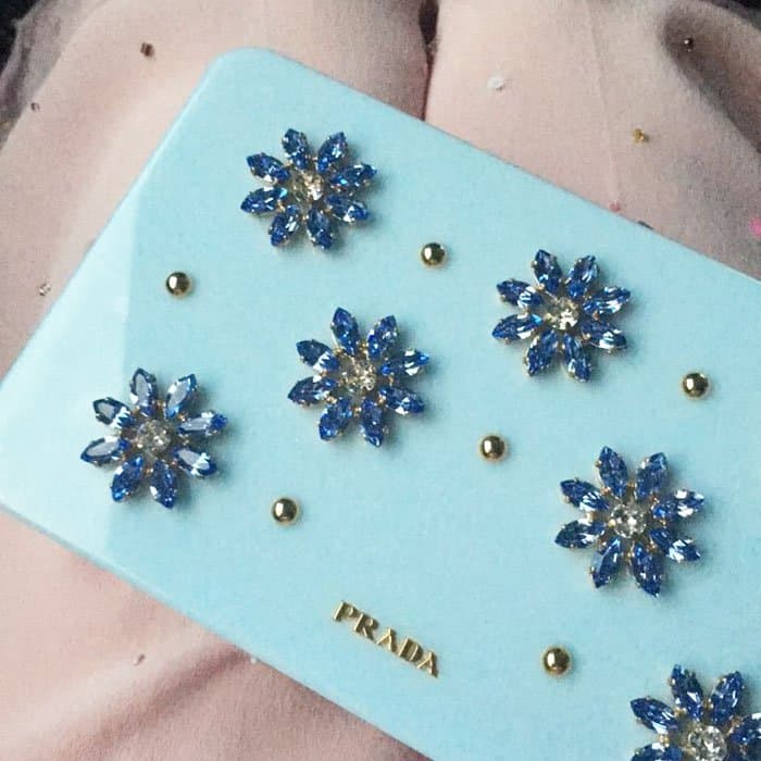 Mackenzie uploads a close up of her gorgeous Prada clutch