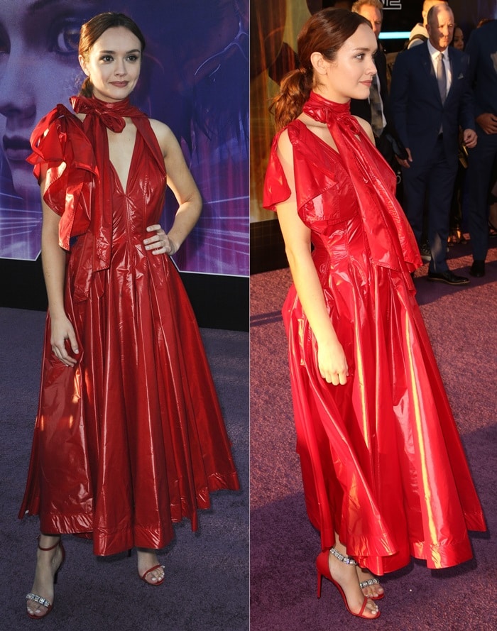 Olivia Cooke's Calvin Klein 205W39NYC lightweight nylon dress is sleeveless at left and features a short drop-shoulder right sleeve