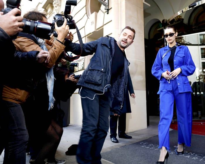 Bella Hadid steps out in Paris on October 3, 2017, wearing a structured jacket by Marques’Almeida, Off-White "For Walking" pumps, and sleek Roberi Fraud sunglasses, showcasing her bold and edgy street style