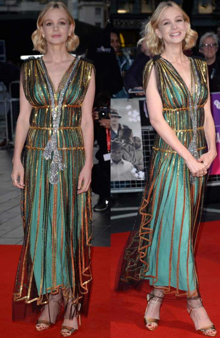 Carey Mulligan dazzles in a Grecian-inspired Gucci Resort 2018 gown with metallic gold and green accents, paired with Francesco Russo sandals
