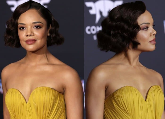 Tessa Thompson channels timeless elegance with vintage-inspired Hollywood waves, perfectly complementing her marigold Schiaparelli gown