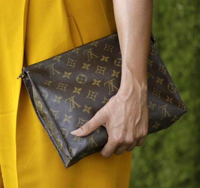 Tracee Ellis Ross carring a Louis Vuitton logo clutch at the 8th Annual Veuve Clicquot Polo Classic