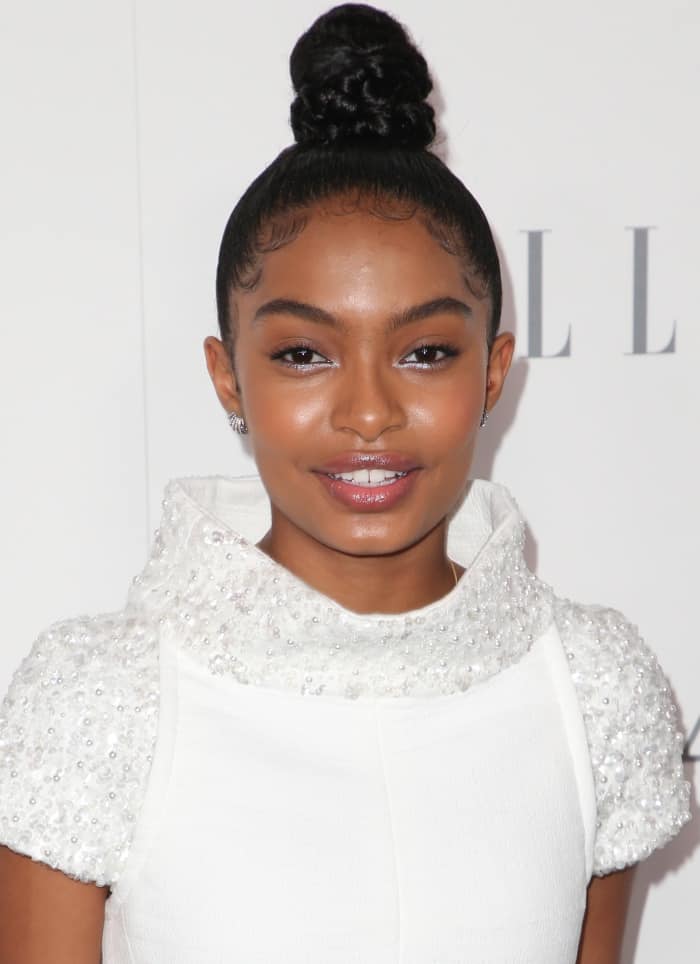 Yara Shahidi styled her hair in a chic high bun and kept her makeup fresh with glossy lips and subtle eye makeup, highlighting her natural beauty
