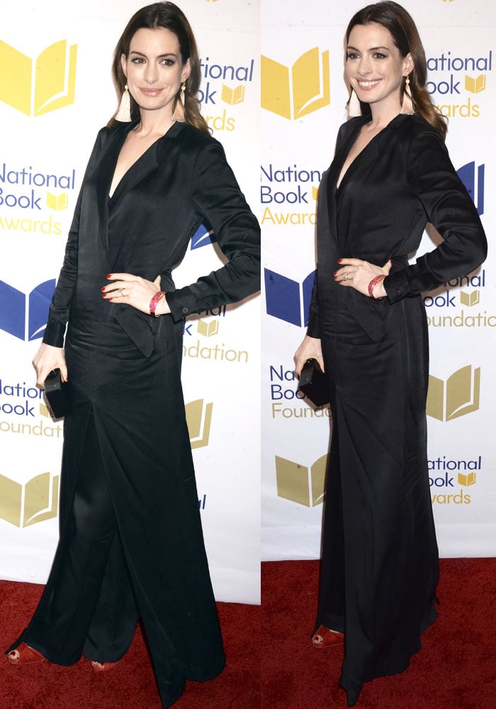 Anne Hathaway exudes effortless elegance in a tuxedo-inspired Halston Heritage satin shirt dress layered over tailored pants, styled with bold tassel earrings and red-soled Christian Louboutin heels at the National Book Awards