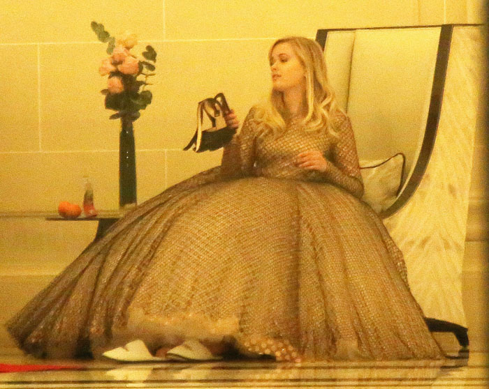 Ava Elizabeth Phillippe with her Christian Louboutin heels in hand while waiting for the le Bal des Débutantes to go underway at The Peninsula Hotel in Paris, France