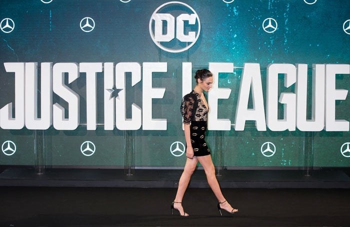 Gal Gadot's sleek Stuart Weitzman heels not only added height but also elongated her legs, enhancing her elegant and statuesque presence at the Justice League event