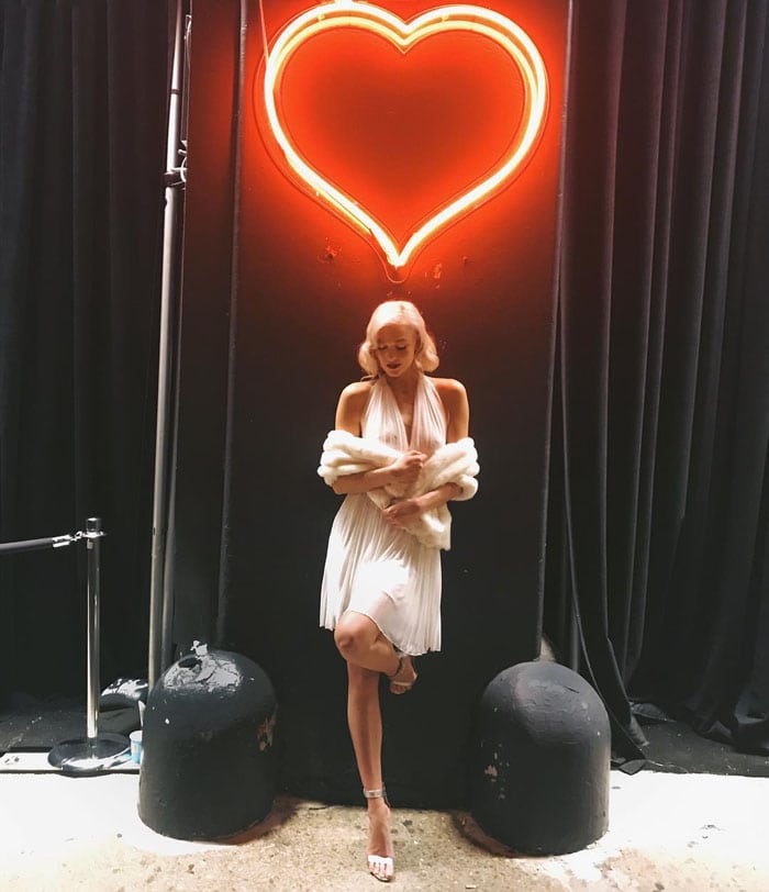 Karlie throws on a fur shrug to her Marilyn Monroe look