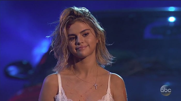 Selena Gomez shows off her Tiffany Co. diamond cross pendant necklace