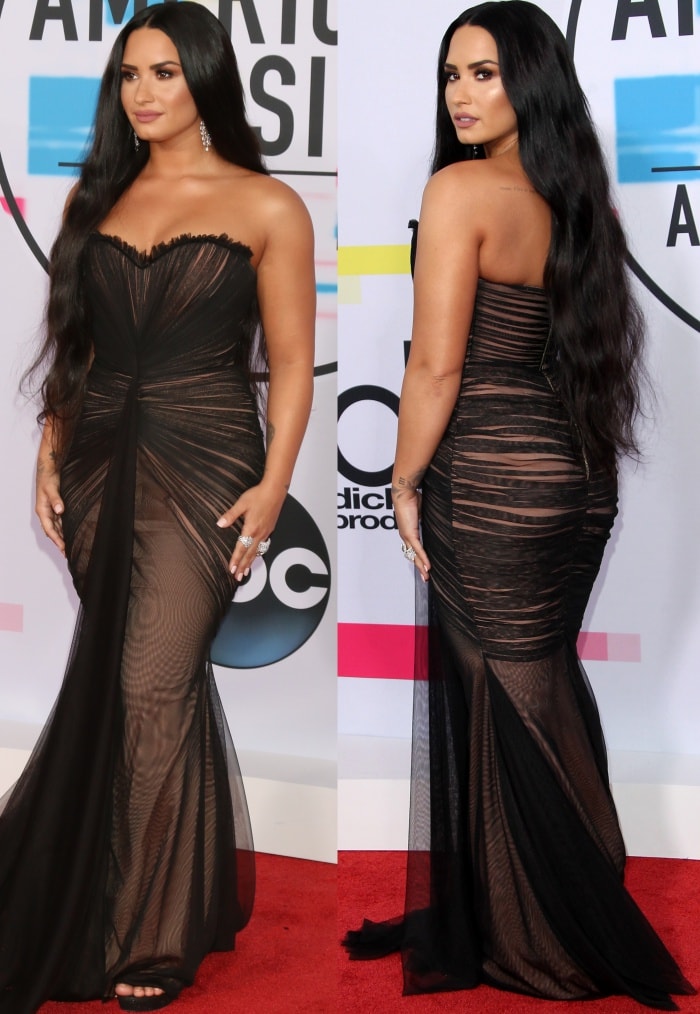 Demi Lovato wearing a black Ester Abner Spring 2018 gown and Stuart Weitzman sandals at the 2017 American Music Awards