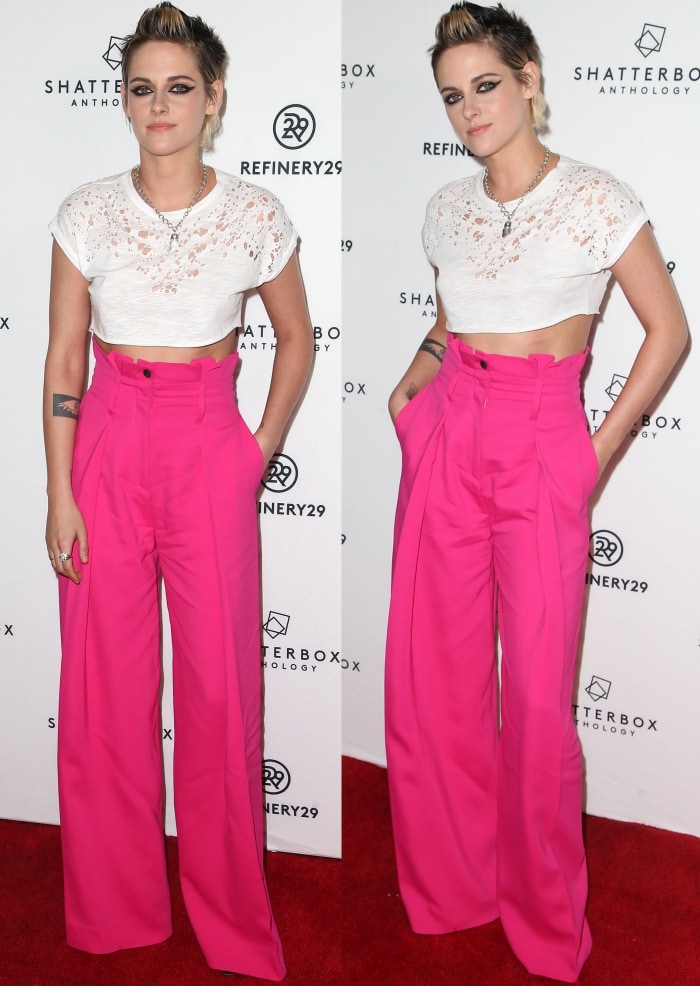 Kristen Stewart turns heads in bold fuchsia Zuhair Murad wide-leg pants paired with a white crop top, exuding effortless edgy chic at the "Come Swim" premiere