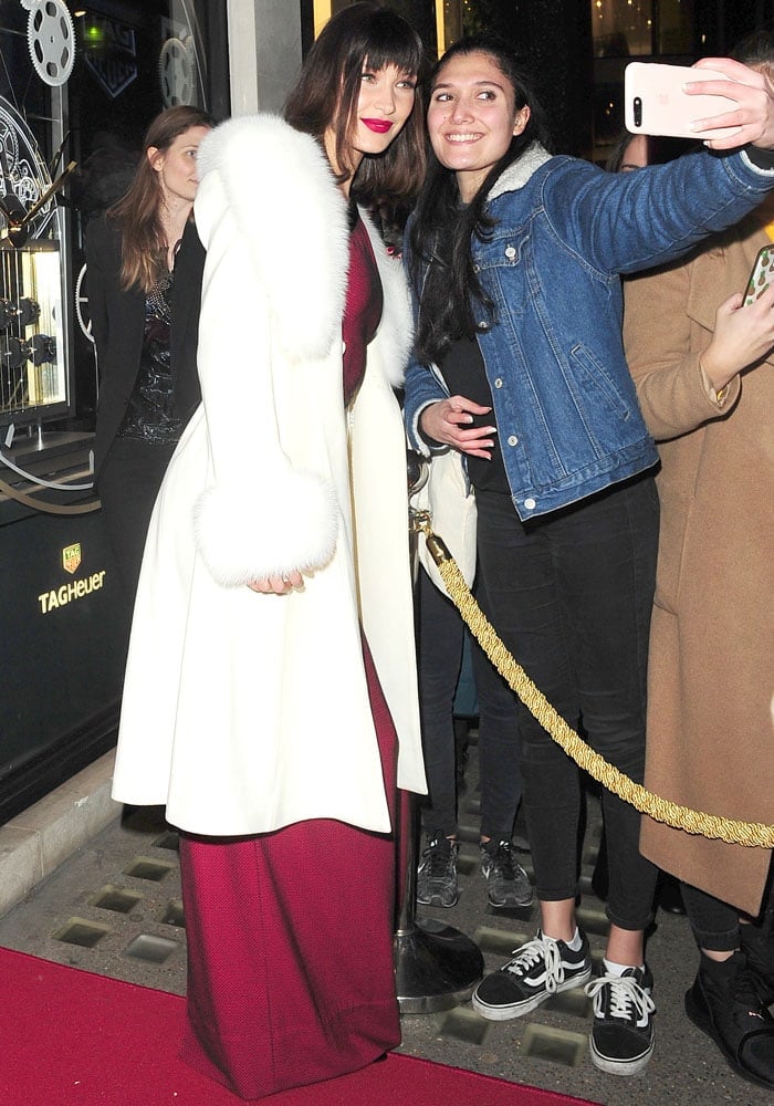 Bella pauses to take a photo with a fan