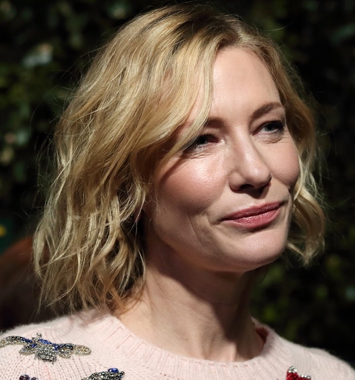 Cate Blanchett showcases soft glam with tousled waves and a natural makeup look that complements the feminine tones of her embellished Alexander McQueen ensemble