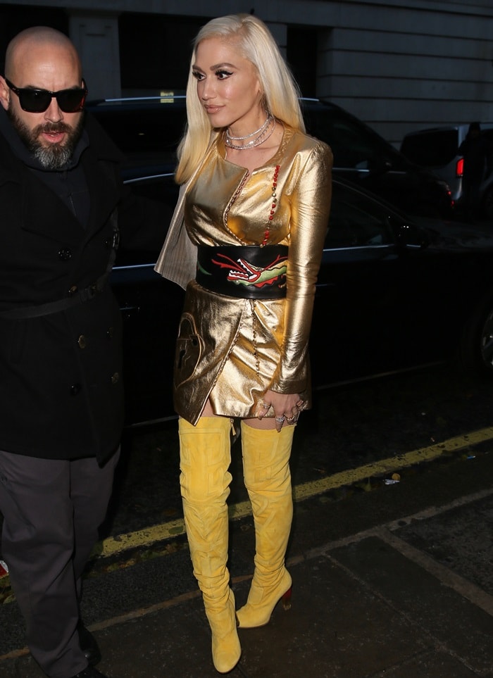 Gwen Stefani arrives at Radio 2 wearing an eye-catching yellow and gold Schiaparelli Spring 2017 Couture ensemble on December 1, 2017