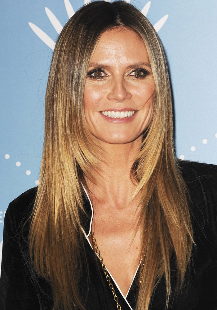Heidi Klum kept her beauty look sleek and polished with straight hair, smoky eyes, and a radiant smile
