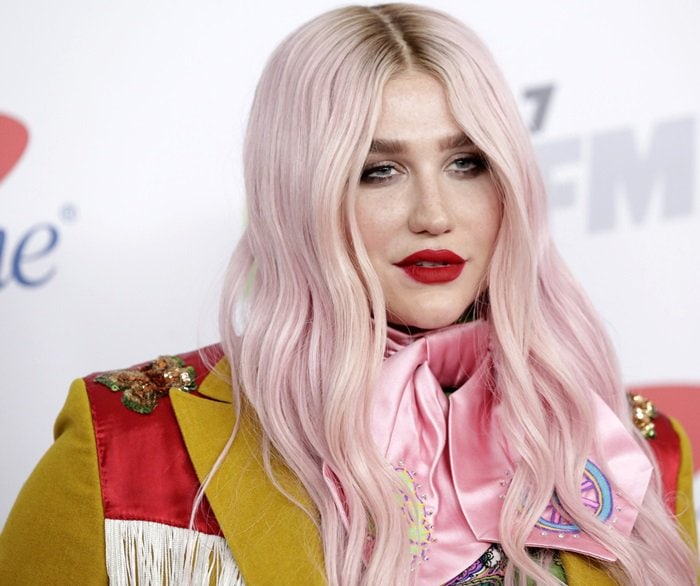 Kesha channels whimsical retro glamour with pastel-pink hair and a bold silk bow at the 2017 KIIS FM Jingle Ball