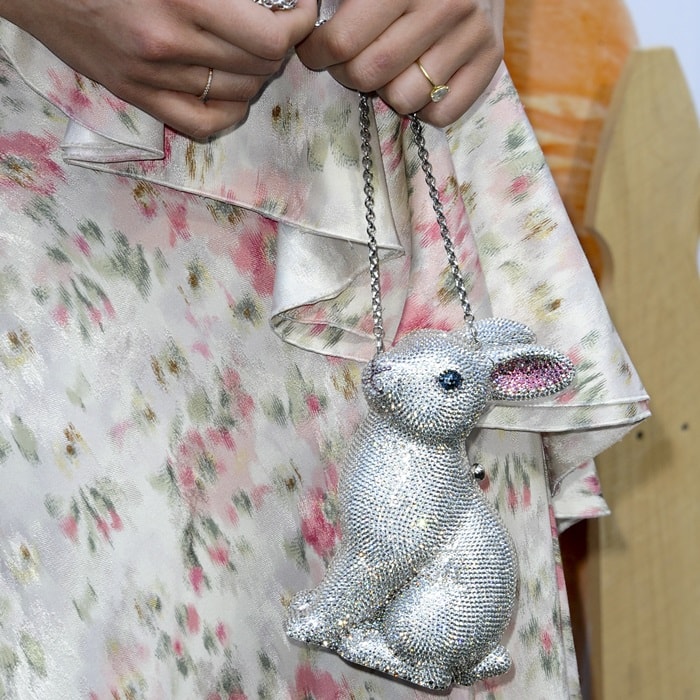 To complement the movie's theme, Robbie accessorized with a whimsical, crystal-embellished Judith Leiber Couture bunny clutch