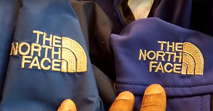Close-up comparison of The North Face logos to spot differences between genuine and counterfeit jackets