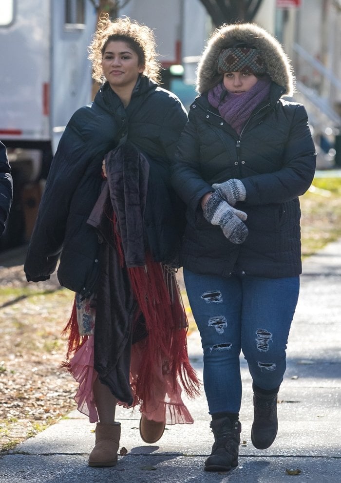 Zendaya keeps warm in a black puffer jacket and UGG Classic Mini II boots while heading to the set of The Greatest Showman