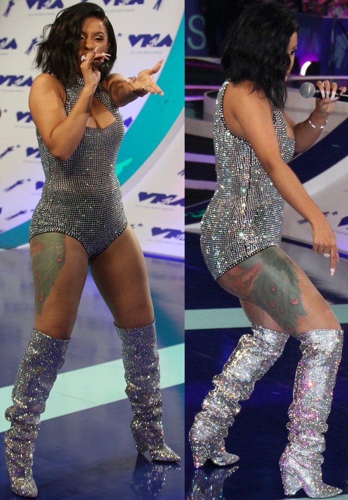 Cardi B commands the stage in a crystal-studded bodysuit paired with slouchy, thigh-high Saint Laurent Niki boots that catch the light with every move