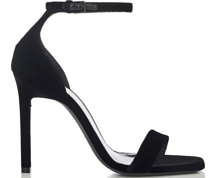 Saint Laurent’s iconic “Amber” black velvet sandals feature a minimalist silhouette with a slim ankle strap, open toe, and stiletto heel that make them a timeless red-carpet favorite