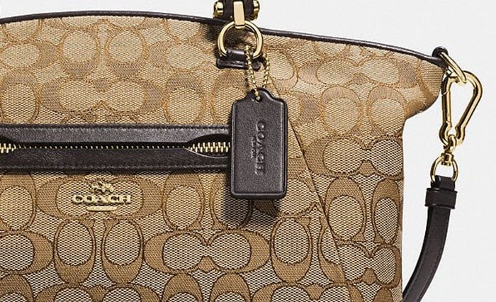 Close-up view of the Coach Signature “C” canvas pattern with gold-tone hardware — one of the easiest ways to authenticate genuine Coach craftsmanship