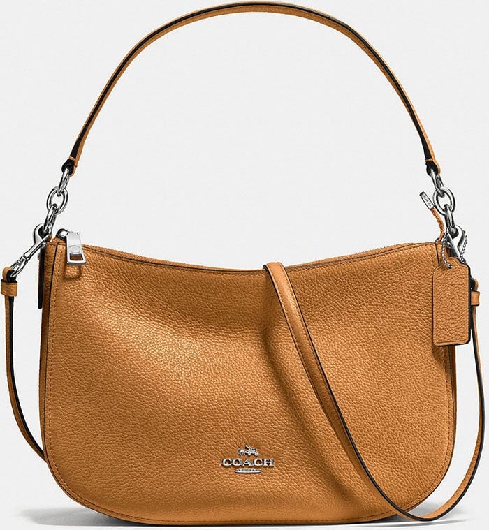 A classic pebbled-leather Coach shoulder bag featuring a sleek silhouette and silver hardware — a timeless example of the brand’s understated luxury craftsmanship