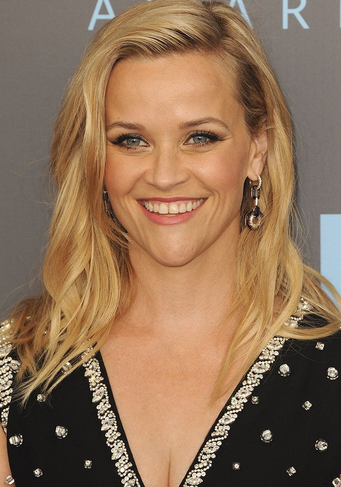 Reese Witherspoon stuns in a sleek black gown adorned with sparkling embellishments at the 23rd Annual Critics' Choice Awards