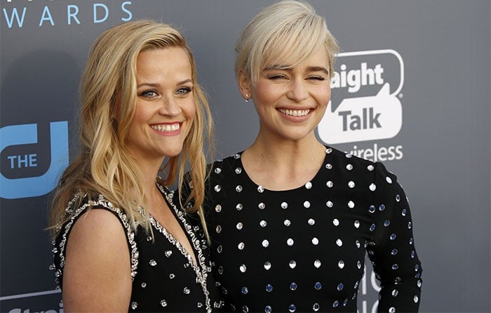 Reese Witherspoon and Emilia Clarke dazzle in coordinating black dresses adorned with crystal embellishments