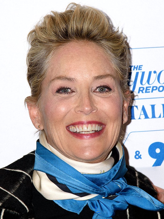 Sharon Stone topped everything off with a blue-white-and-navy satin scarf tied tightly around her neck