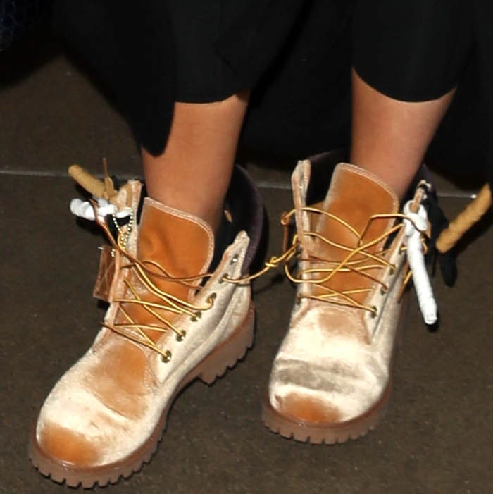 Khloé Kardashian wearing Timberland x Off-White leather lace-up boots at the Los Angeles International Airport