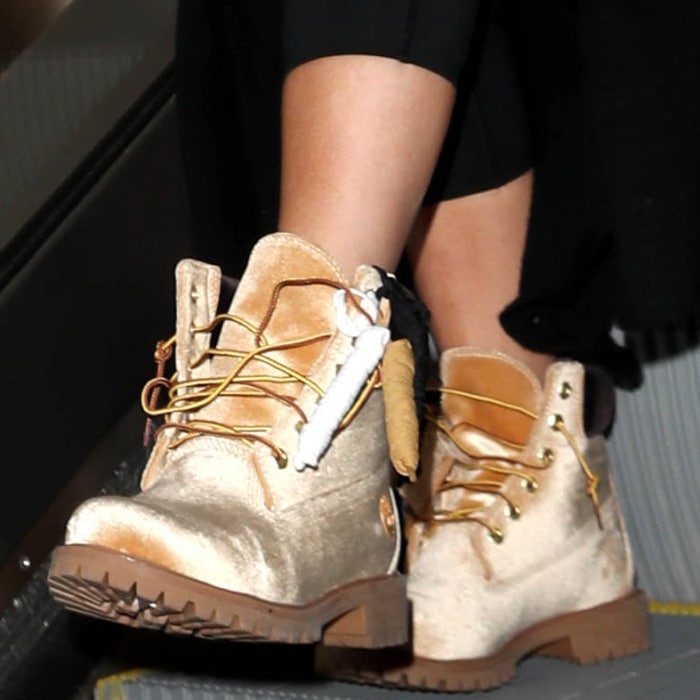 Khloé Kardashian wearing Timberland x Off-White leather lace-up boots at the Los Angeles International Airport
