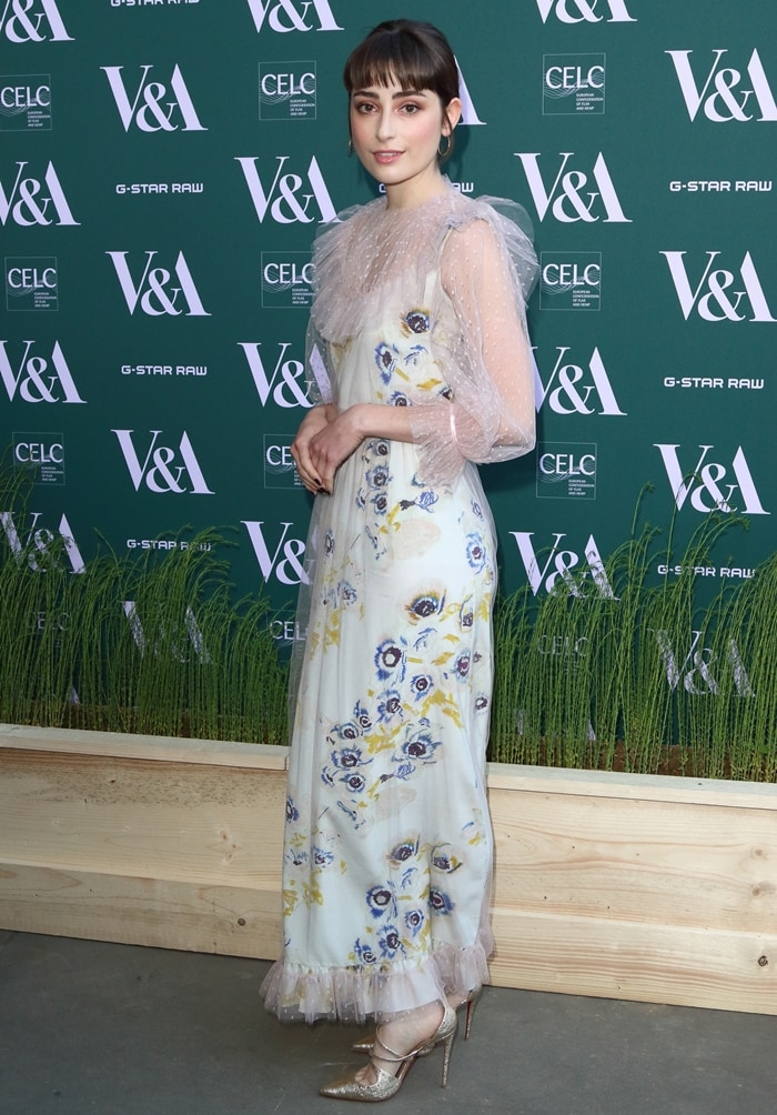 Ellise Chappell wearing a playful Alice Archer dress featuring romantic watercolor floral print
