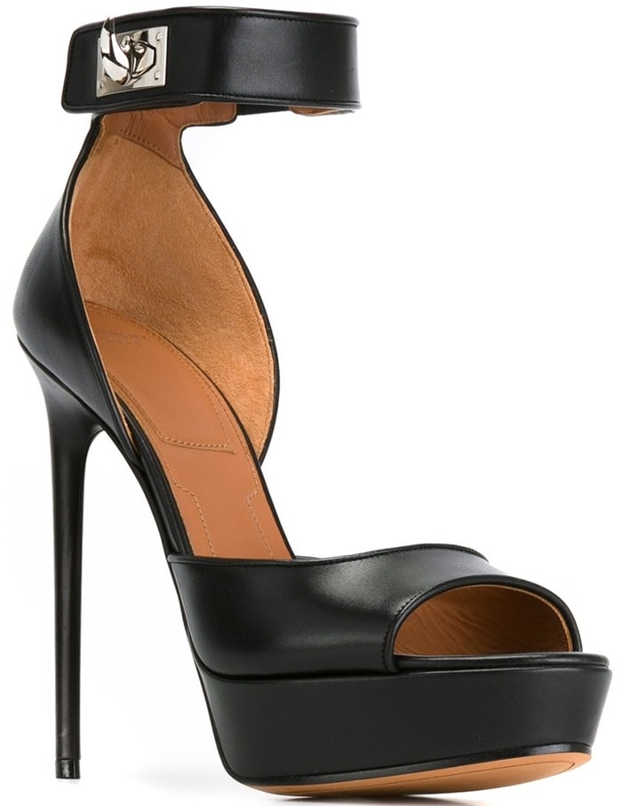 These black leather heels feature a peep toe, a platform sole, an ankle strap, a silver-tone twist lock fastening and a high stiletto heel