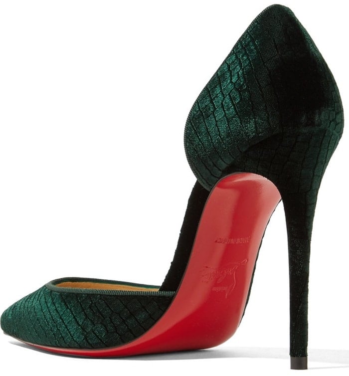 Made from plush croc-effect velvet in a rich emerald hue, these heels are set on a slim stiletto heel