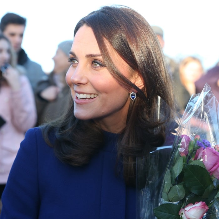 Catherine, Duchess Of Cambridge (aka Kate Middleton) wearing a marine blue Goat coat while greeting visitors at the opening of the Action On Addiction Community Treatment Centre in Wickford, England, on February 7, 2018