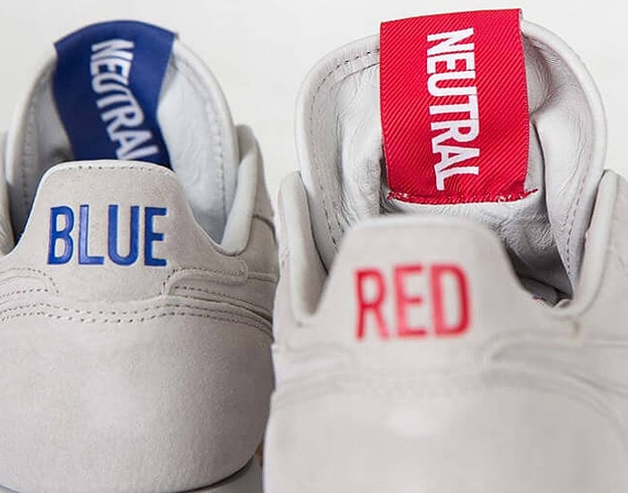 The "BLUE" and "RED" texts and corresponding "NEUTRAL" tongue tags on the Kendrick Lamar x Reebok 'Classic Leather' sneakers.