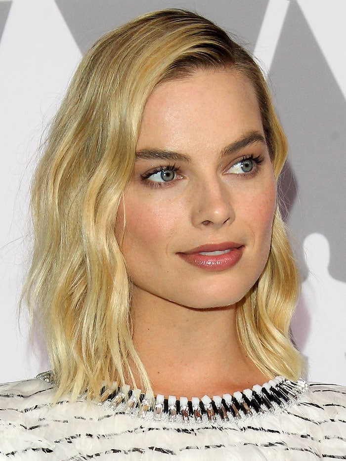 Margot Robbie shows off her fresh makeup look and softly tousled blonde bob at the 90th annual Oscars Nominees Luncheon