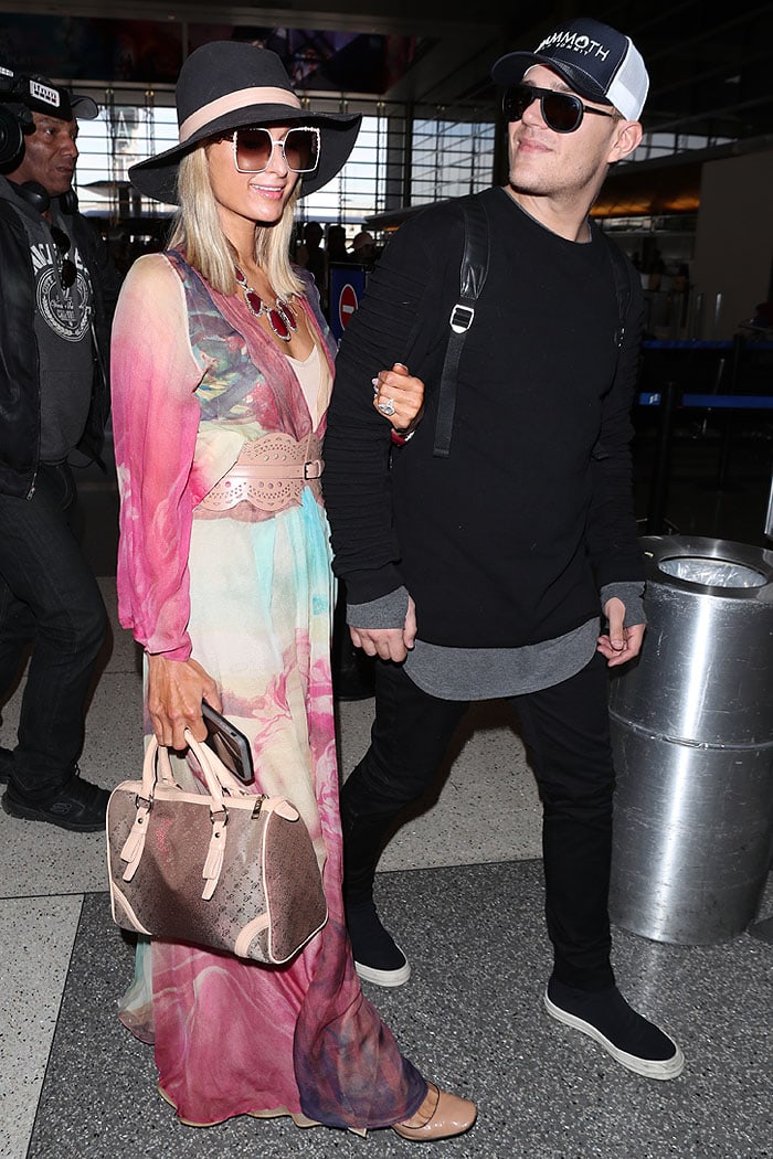 Paris Hilton and fiancé Chris Zylka departing from Los Angeles International Airport (LAX) in Los Angeles, California, on January 24, 2018.