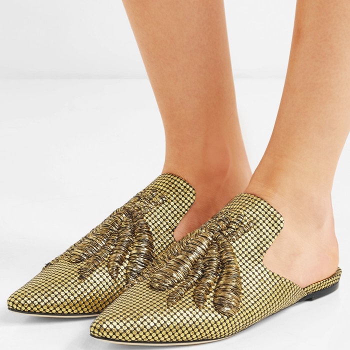This slipper is adorned with spiders along the fil coupé canvas upper